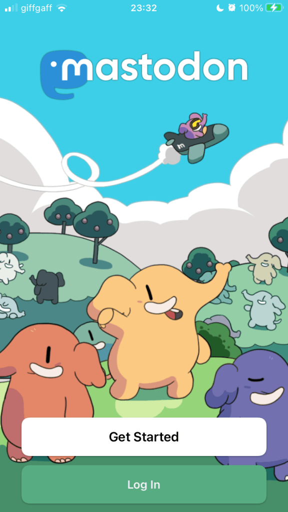 The Mastodon logo over a cartoon scene of various coloured elephants in hilly green countryside, and one elephant flying overhead in a small plane. There are two buttons: ‘Get started’ and ‘Log in’.