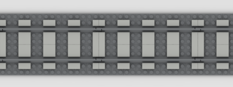 A straight stretch of grey LEGO track, with matching plates used to infill the spaces in a basic representation of ballast, and light grey tiles covering the original sleepers, giving the impression of two-stud-wide sleepers with two-stud-wide spaces between them.
