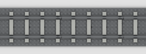 A straight stretch of grey LEGO track, with matching plates used as ballast. Light grey tiles are placed on the left half of each LEGO sleeper, giving the impression of one-stud-wide sleepers with three studs of space between them.