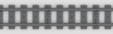 A short length of straight LEGO track, in a dark grey colour, with sleepers that are essentially 8-by-2 plates, with 2-stud gaps separating them. The rails are one stud in from the ends of the sleepers.
